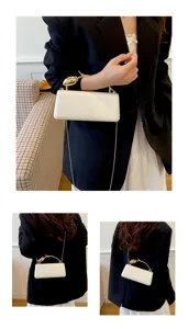 Elegante witte avondtas clutch met gouden bloem handvat en ketting voor dames feesten.
