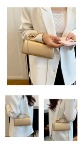 Elegante dames clutch tas met metalen bloem handvat en ketting voor mooie feestjes.