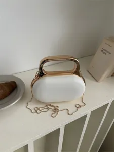 Elegant white acrylic handbag with gold metal handle and chain strap for women evening party.