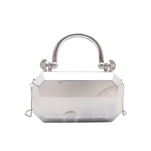 Silver metallic acrylic box bag, elegant evening clutch with handle and chain strap.