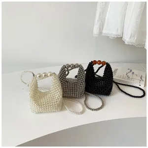 Handmade beaded evening handbag, stylish pearl crossbody shoulder bag detail view.
