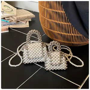 Handmade pearl beaded mini crossbody bag, fashionable summer handbag for women and girls.