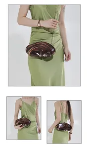 Acrylic marbled shell evening clutch detail shot, elegant chain strap and hard case design.