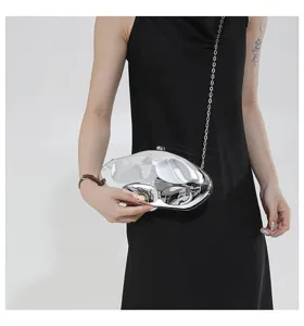 Silver metallic liquid shape acrylic hard shell evening clutch bag with metal chain detail.