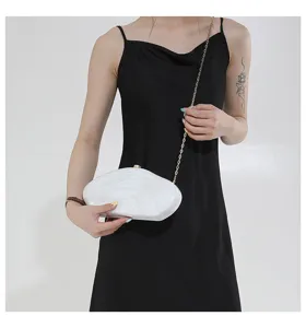 White acrylic shell clutch bag with gold chain strap, fashionable evening handbag for women.