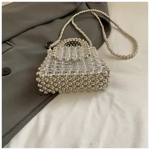 Handmade clear silver beaded mini crossbody bag and stylish elegant handbag accessory.