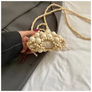 Bolso cruzado mini de cuentas de madera hecho a mano, bolso tejido chic con flecos.