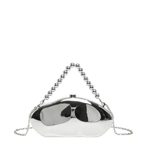 Detail view of the silver metallic acrylic evening clutch with beaded handle and chain.
