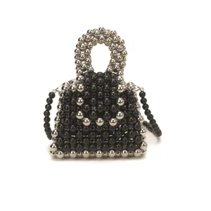 Handmade beaded mini handbag with top handle and crossbody chain for stylish summer daily wear.