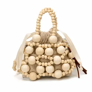 Bolso de mano mini de cuentas de madera beige, bolso bombonera tejido a mano para mujeres.