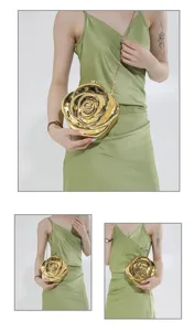 Close-up details of the elegant gold rose-shaped acrylic evening clutch bag with chain strap.