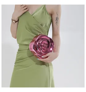 Metallic pink rose shape acrylic evening clutch bag, unique designer fashion handbag detail.