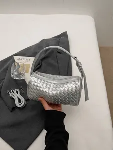 Chic silver woven cylindrical handbag, elegant top-handle shoulder bag for summer chic.