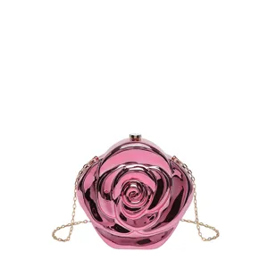Glossy pink rose shaped acrylic clutch bag detail, elegant chain strap and hard shell design.
