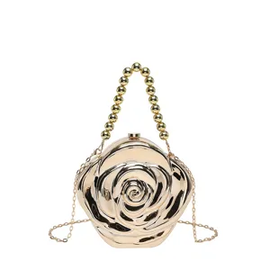 Gold rose shaped acrylic evening clutch bag with beaded handle and chain strap for women.