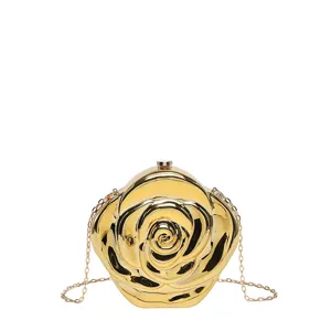 Close-up view of the metallic gold rose-shaped clutch bag showcasing intricate petal details and chain.