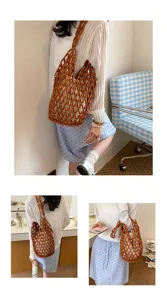 Woven beaded bucket shoulder bag with inner pouch, stylish hollow design for beach vacation.