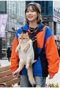Outdoor pet carrier backpack detail showing breathable mesh, front wearing style and cat inside.
