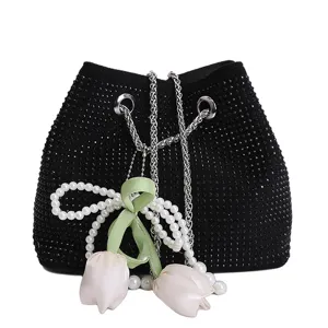 Black rhinestone bucket bag with chain strap and pearl tulip pendant detail for stylish wear.
