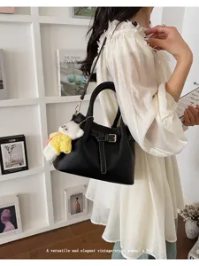 Versatile and elegant vintage-style women's shoulder bag with cute knit bear pendant.