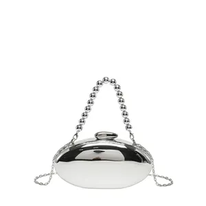 Silver acrylic oval clutch bag with beaded handle and chain strap for women summer fashion.