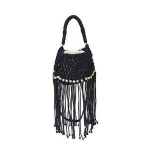 Black woven fringe bucket bag detail, handmade macrame style with wooden beads.