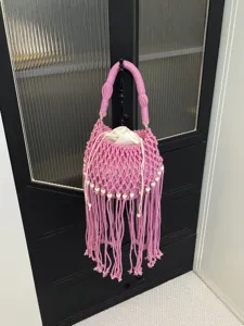 Candy color woven fringe bucket bag, stylish hollow beach shoulder tote for women main view.