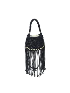 Handmade macrame fringe bucket bag with wooden beads and white inner pouch for beach vacation.