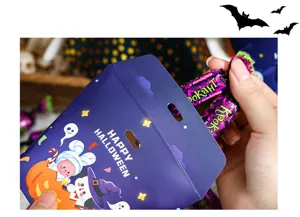 Halloween candy paper gift packaging box with cute cartoon ghost pumpkin design for party decor.