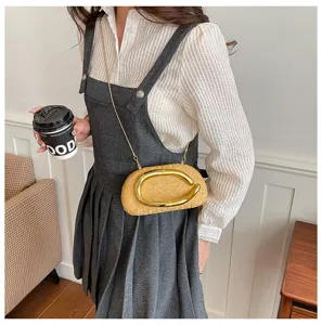 Stylish irregular evening shoulder bag with chic gold buckle and chain strap for women.