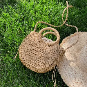Handmade woven straw handbag for women summer beach bag featuring stylish round handles and shoulder strap.