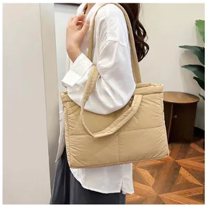 Quilted puffer tote bag side view, soft cotton padded shoulder bag for autumn commute.