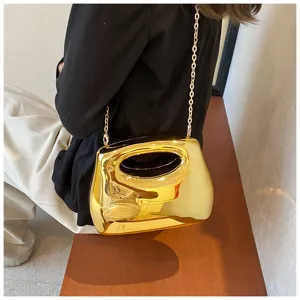 Gold acrylic evening clutch bag with chain strap, stylish hard-shell design for women.