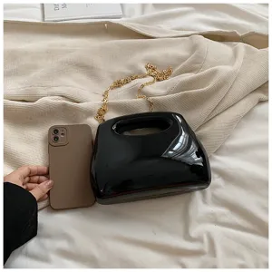 Black glossy acrylic hard shell evening bag for women with gold chain shoulder strap elegant