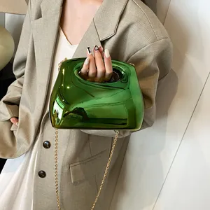 Green acrylic hard shell clutch bag for women, stylish crossbody handbag with gold chain.