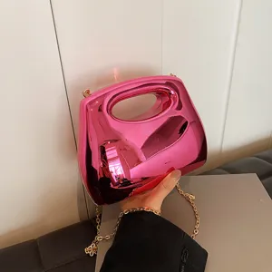 Glossy pink acrylic hard shell handbag with gold chain, stylish women evening crossbody bag.