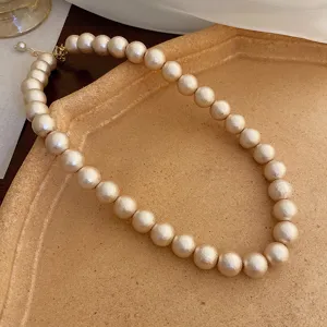 French vintage matte pearl necklace women elegant clavicle chain delicate jewelry detail shot