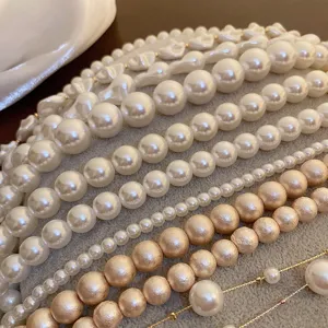 Detailed shot of assorted pearl necklaces featuring baroque and round beads for layered looks.