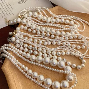 Detailed view of French vintage multi-layer pearl necklace with textured metallic beads.