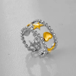 Anillo ajustable bicolor de acero inoxidable con estrellas y corazones huecos, joyas chic.