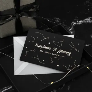 Schwarzes Grusskarten-Set mit Goldfolien-Sternbild-Design, beschreibbare Karte mit Umschlag und Box.