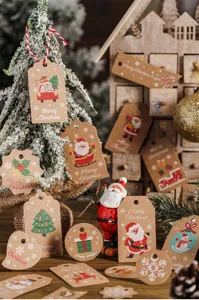 Detailed view of Christmas kraft paper gift tags with festive Santa and tree prints.
