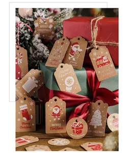 Kraft paper Christmas gift tags detail view, featuring assorted festive holiday designs with string.