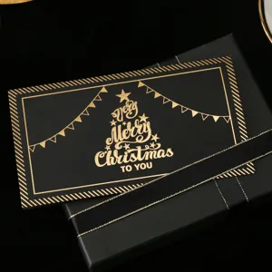 Schwarze vergoldete Weihnachtsgrußkarte mit Geschenkbox, elegantes Feiertagsdesign.