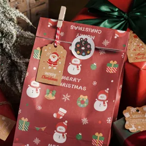 Thick Christmas kraft paper gift bags with festive tags and hemp rope for holiday packaging.