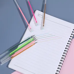 Detailed shot of colorful gel pen refills with vibrant ink lines on a memo notebook.