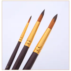 Fine detail brush set detail view, showing soft bristles, golden ferrule and wooden handle.