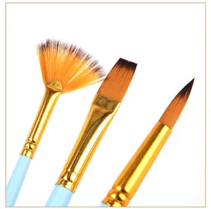 Close-up detail of art paintbrushes featuring gold ferrules and blue handles for painting.