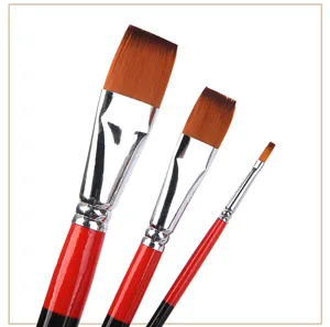 Close-up detail of three professional art paintbrushes with fine synthetic bristles and handles.