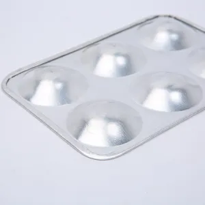 Close-up detail of the 6-hole aluminum mixing palette, showing smooth metallic texture.